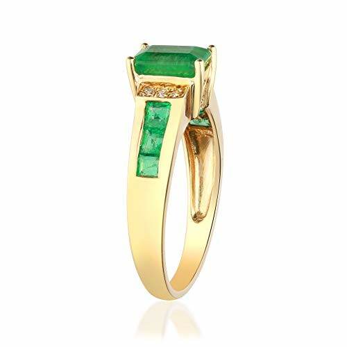 Gold ring with green gemstones