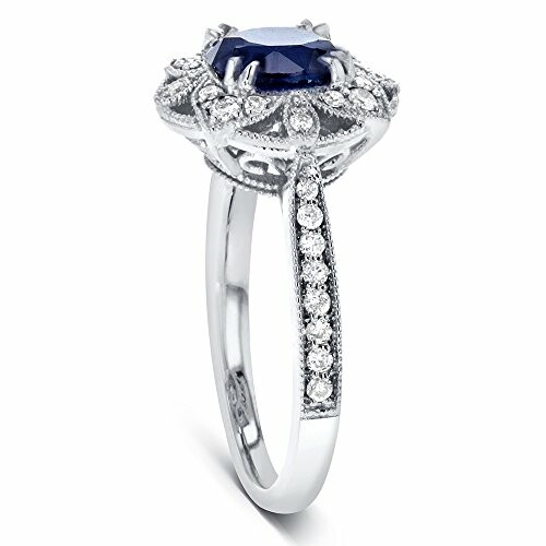 Elegant vintage-style ring with sapphire and diamond accents.