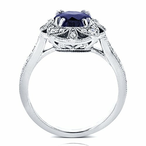 Vintage-style sapphire ring with intricate detailing.